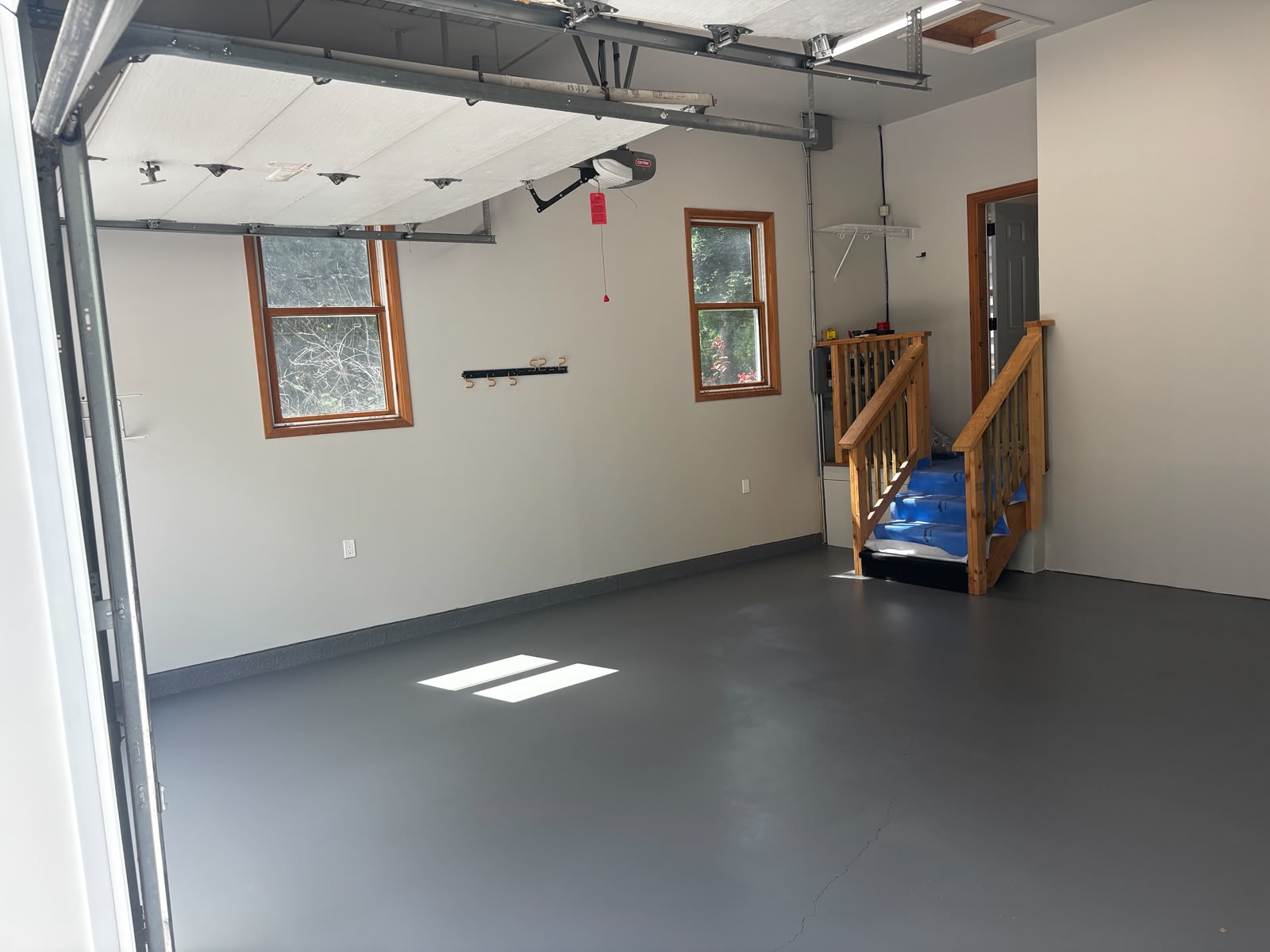 Freshly painted garage interior with clean walls and floor