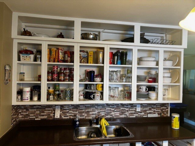 The same shelving unit after refinishing, in a clean white